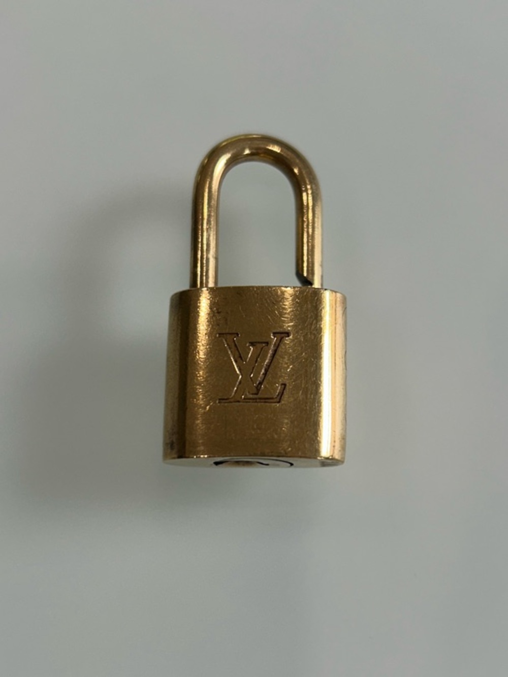 Louis Vuitton Gold-tone LV Signature Padlock